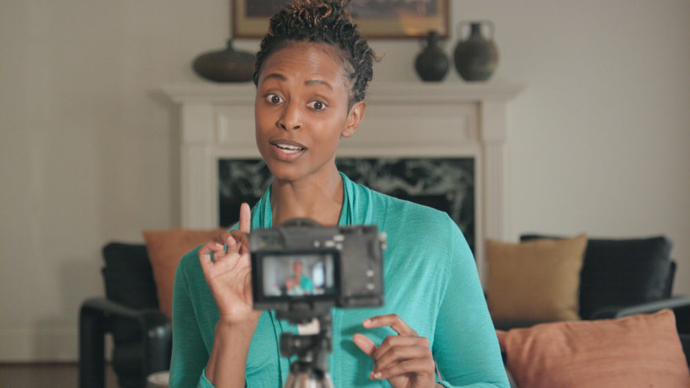 Beautiful African-American Vlogger Recording Livestream for her Show